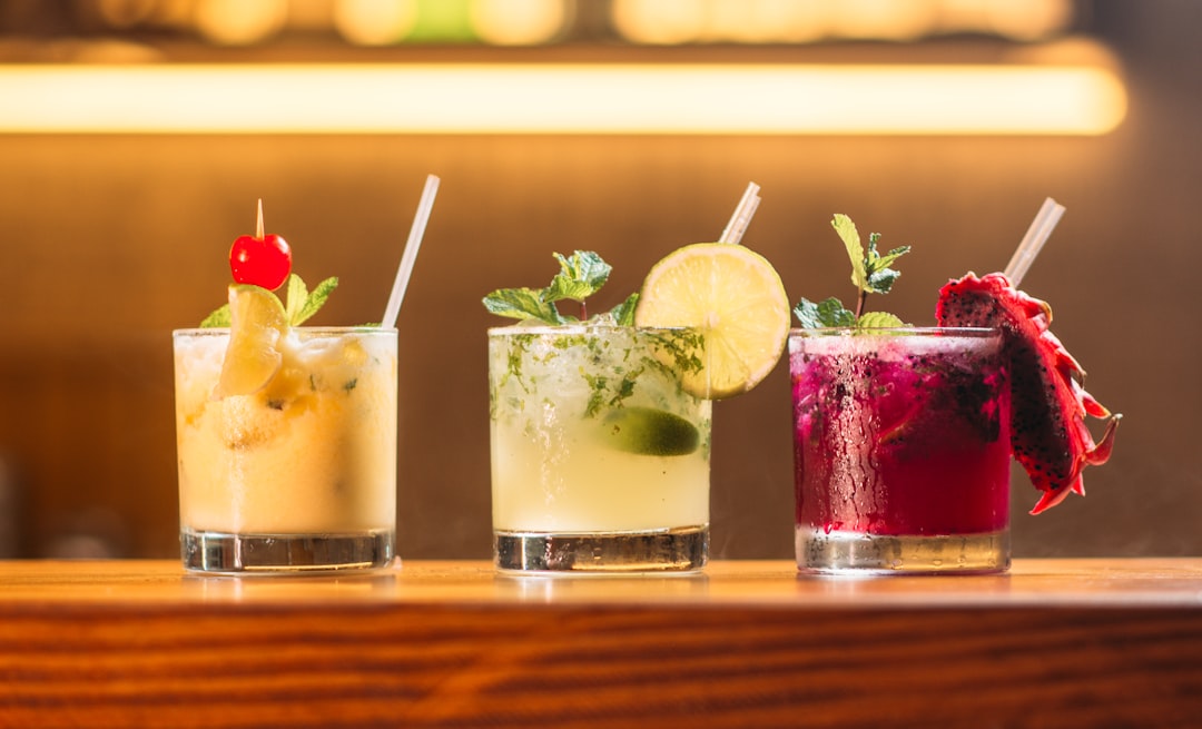 A collection of colorful tiki cocktails with elaborate garnishes